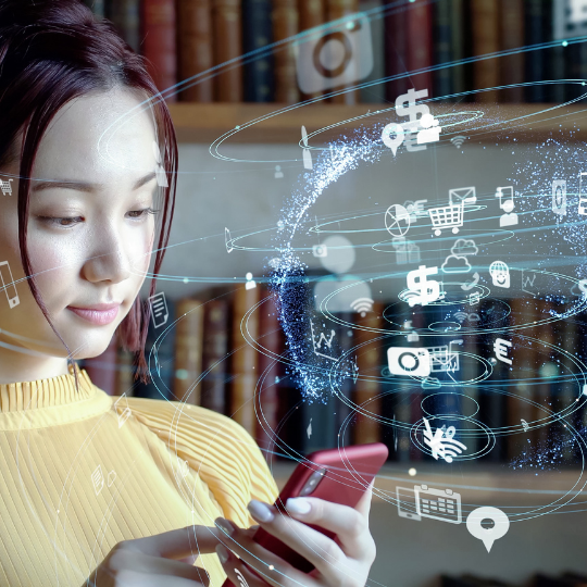 Permanent EdTech Recruiting Services image of Asian woman on cell phone with digital signs around her